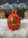 Pumpkin moving snow globe