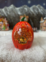 Pumpkin moving snow globe