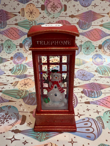 Snowman in phone box snow globe