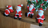 Assorted Mini Sitting Santas in Bags